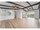 Open concept living room with kitchen view and wood floors at 6885 Stone Dr, Las Vegas, NV 89110