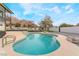 Relaxing kidney-shaped pool with a modern design at 6885 Stone Dr, Las Vegas, NV 89110