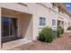 Backyard patio featuring rock landscaping, air conditioning units and slider at 700 Aztec Cir # 2E, Mesquite, NV 89027