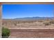 Expansive desert landscape view from the backyard with a sturdy metal fence and rock landscaping at 700 Aztec Cir # 2E, Mesquite, NV 89027