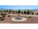 Relaxing outdoor common area featuring seating, desert landscaping, and walking paths, perfect for community residents at 700 Aztec Cir # 2E, Mesquite, NV 89027