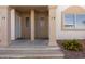 Ground level entrance featuring well-manicured landscaping, stone covered yard and neutral colors at 700 Aztec Cir # 2E, Mesquite, NV 89027