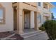 Inviting condo entrance featuring columns, neutral tones, and well-maintained landscaping at 700 Aztec Cir # 2E, Mesquite, NV 89027