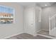 Bright entryway featuring laminate flooring, a window, and staircase to the second level at 700 Aztec Cir # 2E, Mesquite, NV 89027