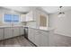 Beautiful white kitchen features stainless steel appliances and elegant marble countertops at 700 Aztec Cir # 2E, Mesquite, NV 89027