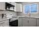 This kitchen features stainless steel appliances, marble countertops, and bright, natural lighting at 700 Aztec Cir # 2E, Mesquite, NV 89027