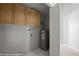 Functional laundry room with ample cabinet space and a convenient water heater at 700 Aztec Cir # 2E, Mesquite, NV 89027