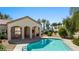 Inviting backyard pool and covered patio, perfect for outdoor entertaining and relaxation under the desert sun at 700 Aztec Cir # 2E, Mesquite, NV 89027