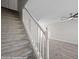 Carpeted staircase leading to a living area with modern ceiling fan at 700 Aztec Cir # 2E, Mesquite, NV 89027