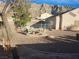 Outdoor seating area around a fire pit in the backyard, offering a serene space with mountain views and a pool at 7076 Oakleigh Dr, Las Vegas, NV 89110