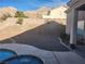 Backyard featuring a pool, desert landscaping, and mountain views, perfect for outdoor relaxation and entertaining at 7076 Oakleigh Dr, Las Vegas, NV 89110