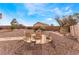 Relax in the spacious backyard with a charming stone patio, perfect for outdoor gatherings at 7076 Oakleigh Dr, Las Vegas, NV 89110