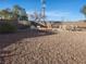 Gravel backyard featuring desert landscaping and several seating arrangements, ready for outdoor enjoyment and entertaining at 7076 Oakleigh Dr, Las Vegas, NV 89110