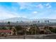 Enjoy panoramic city views with palm trees, mountains, and the vibrant skyline in the distance at 7076 Oakleigh Dr, Las Vegas, NV 89110