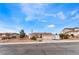 Inviting single-story home with a three-car garage, desert landscaping, and extra storage on the driveway at 7076 Oakleigh Dr, Las Vegas, NV 89110