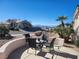 Outdoor patio with seating area and a view of the Las Vegas skyline at 7076 Oakleigh Dr, Las Vegas, NV 89110