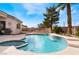 Sparkling pool area with a built-in spa, blue tiled trim, and a spacious patio for relaxation at 7076 Oakleigh Dr, Las Vegas, NV 89110