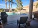 Tranquil backyard features a sparkling pool and outdoor seating area with scenic views at 7076 Oakleigh Dr, Las Vegas, NV 89110