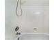 An all white shower featuring new fixtures and a shower head at 7076 Oakleigh Dr, Las Vegas, NV 89110