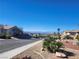 Neighborhood street view with desert landscaping and mountain views at 7076 Oakleigh Dr, Las Vegas, NV 89110