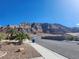 Street view featuring desert landscaping with a mountain backdrop at 7076 Oakleigh Dr, Las Vegas, NV 89110