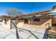 Spacious backyard patio area featuring concrete paving with brick accents and a stucco house exterior at 709 N 22Nd St, Las Vegas, NV 89101