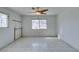 A bedroom with tile flooring and white walls, featuring a window at 709 N 22Nd St, Las Vegas, NV 89101