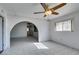 Bright living room featuring tile floors and a ceiling fan with decorative lighting at 709 N 22Nd St, Las Vegas, NV 89101