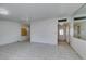 View of a bright living room with tile flooring and an entrance door at 709 N 22Nd St, Las Vegas, NV 89101