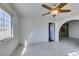 Open living room featuring tile floors and a ceiling fan with decorative lighting at 709 N 22Nd St, Las Vegas, NV 89101