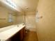 Bathroom featuring a shower and tub combination, a large mirror and vanity at 7949 Long Beach St, Las Vegas, NV 89139