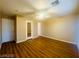 Bedroom with hardwood floors, ceiling fan, neutral walls, and ensuite bathroom at 7949 Long Beach St, Las Vegas, NV 89139