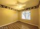 Bedroom featuring ceiling fan and a large window at 7949 Long Beach St, Las Vegas, NV 89139