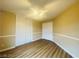 Bedroom with vinyl plank flooring, a ceiling fan and a large closet at 7949 Long Beach St, Las Vegas, NV 89139