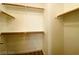 Walk-in closet includes shelving with metal bars and wood trim at 7949 Long Beach St, Las Vegas, NV 89139