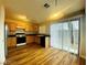 Kitchen featuring oak cabinets, black appliances and direct access to the backyard at 7949 Long Beach St, Las Vegas, NV 89139