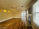 Open-concept living room with a ceiling fan, fireplace and vinyl plank flooring at 7949 Long Beach St, Las Vegas, NV 89139