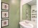 Powder room with white sink and green walls at 795 Ruby Sedona Ave # Lot 128, North Las Vegas, NV 89081