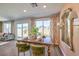 Dining area with wooden table and green velvet chairs at 795 Ruby Sedona Ave # Lot 128, North Las Vegas, NV 89081