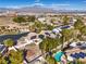 Luxury property with solar panels, desert landscaping, a swimming pool, and city views at 8875 Steven Chase Ct, Las Vegas, NV 89149