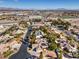 Neighborhood aerial shot showcasing landscaped properties, desert landscape, and surrounding city views at 8875 Steven Chase Ct, Las Vegas, NV 89149