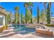 A refreshing backyard pool and spa is surrounded by lush landscaping and a brick patio for outdoor relaxation at 8875 Steven Chase Ct, Las Vegas, NV 89149