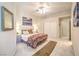 This cozy bedroom features carpeted floors and art at 8875 Steven Chase Ct, Las Vegas, NV 89149