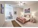 This cozy bedroom features carpeted floors and ample lighting at 8875 Steven Chase Ct, Las Vegas, NV 89149