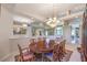 Elegant dining area featuring a large wooden table, chairs, and recessed lighting at 8875 Steven Chase Ct, Las Vegas, NV 89149