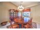 Formal dining room featuring a large wooden table, china cabinet, and elegant chandelier at 8875 Steven Chase Ct, Las Vegas, NV 89149