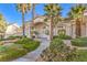 Stunning front entrance featuring columns, a concrete walkway, desert landscaping, and a covered entry at 8875 Steven Chase Ct, Las Vegas, NV 89149