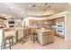 Bright kitchen with tile flooring, central island, and ample counter space at 8875 Steven Chase Ct, Las Vegas, NV 89149