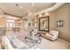 Open-concept living room featuring neutral tones, large windows and stylish furnishings at 8875 Steven Chase Ct, Las Vegas, NV 89149