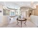 Bright and airy living room with high ceilings, large windows, and neutral tones at 8875 Steven Chase Ct, Las Vegas, NV 89149